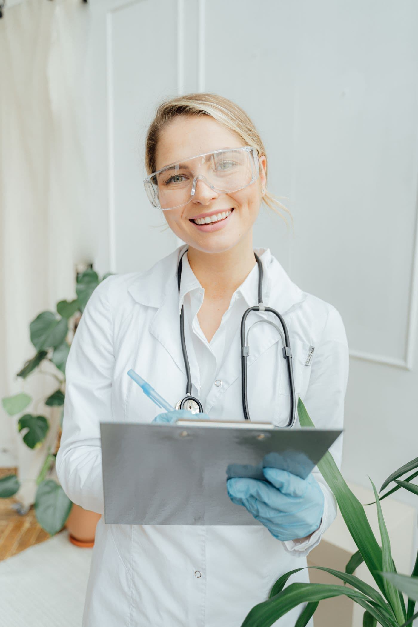 Smiling nurse in scrubs — confidence on the path to licensure